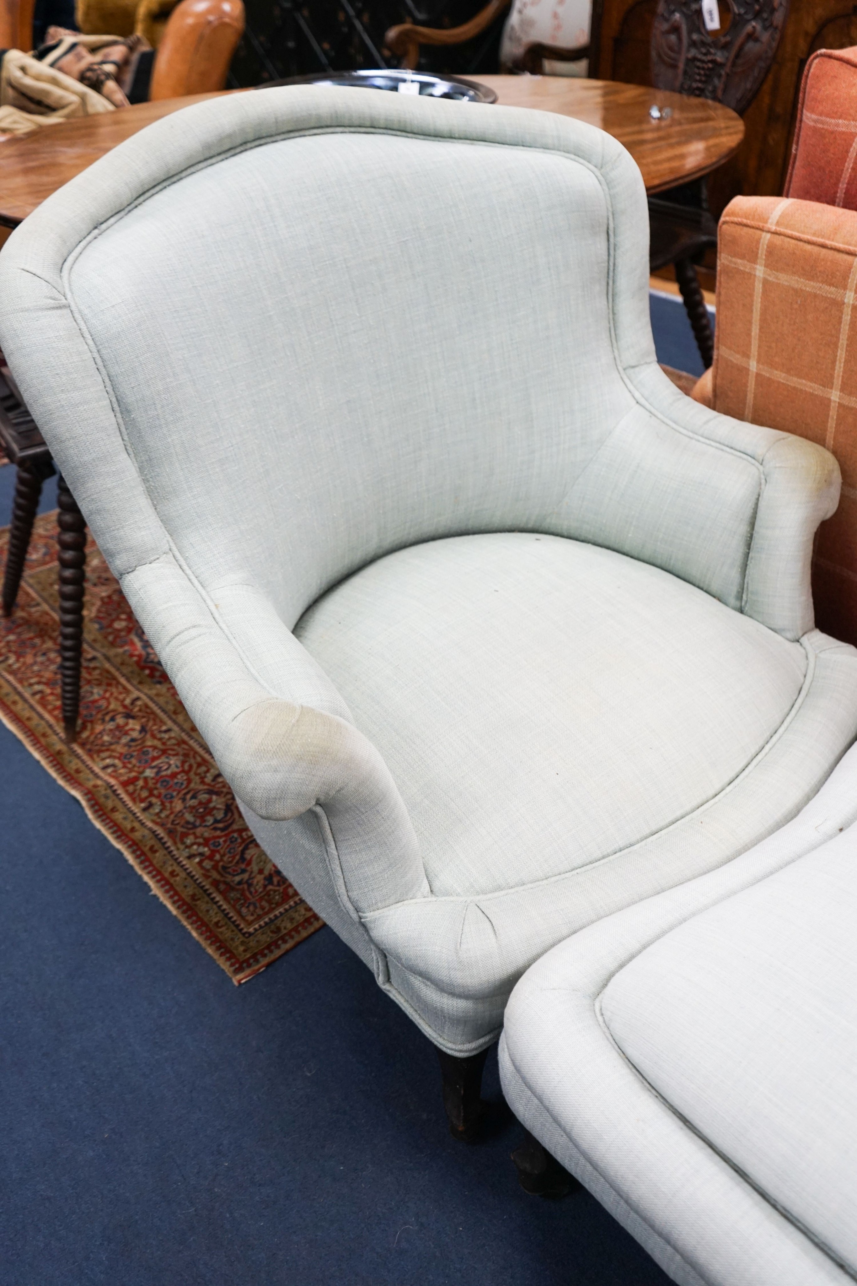 A French Duchesse Brisee comprising a pair of tub armchair and matching stool, on carved beech cabriole legs, chairs width 82cm